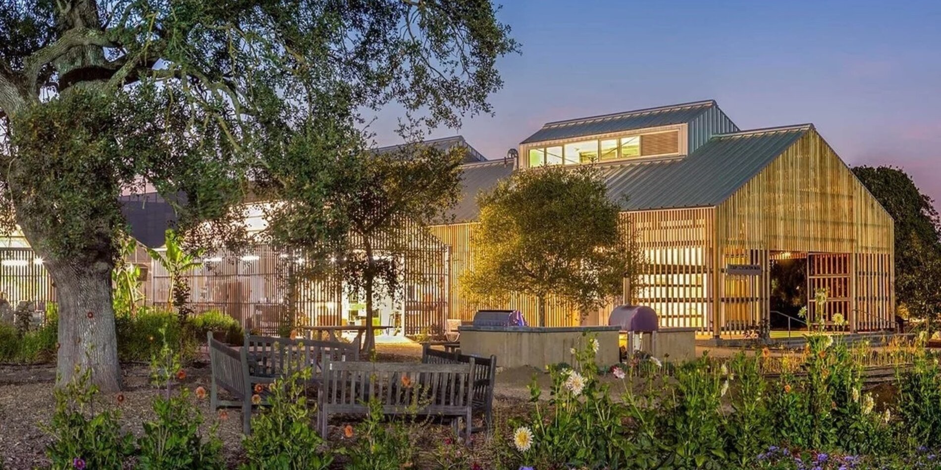 Stanford Barn buildings lit up at dusk