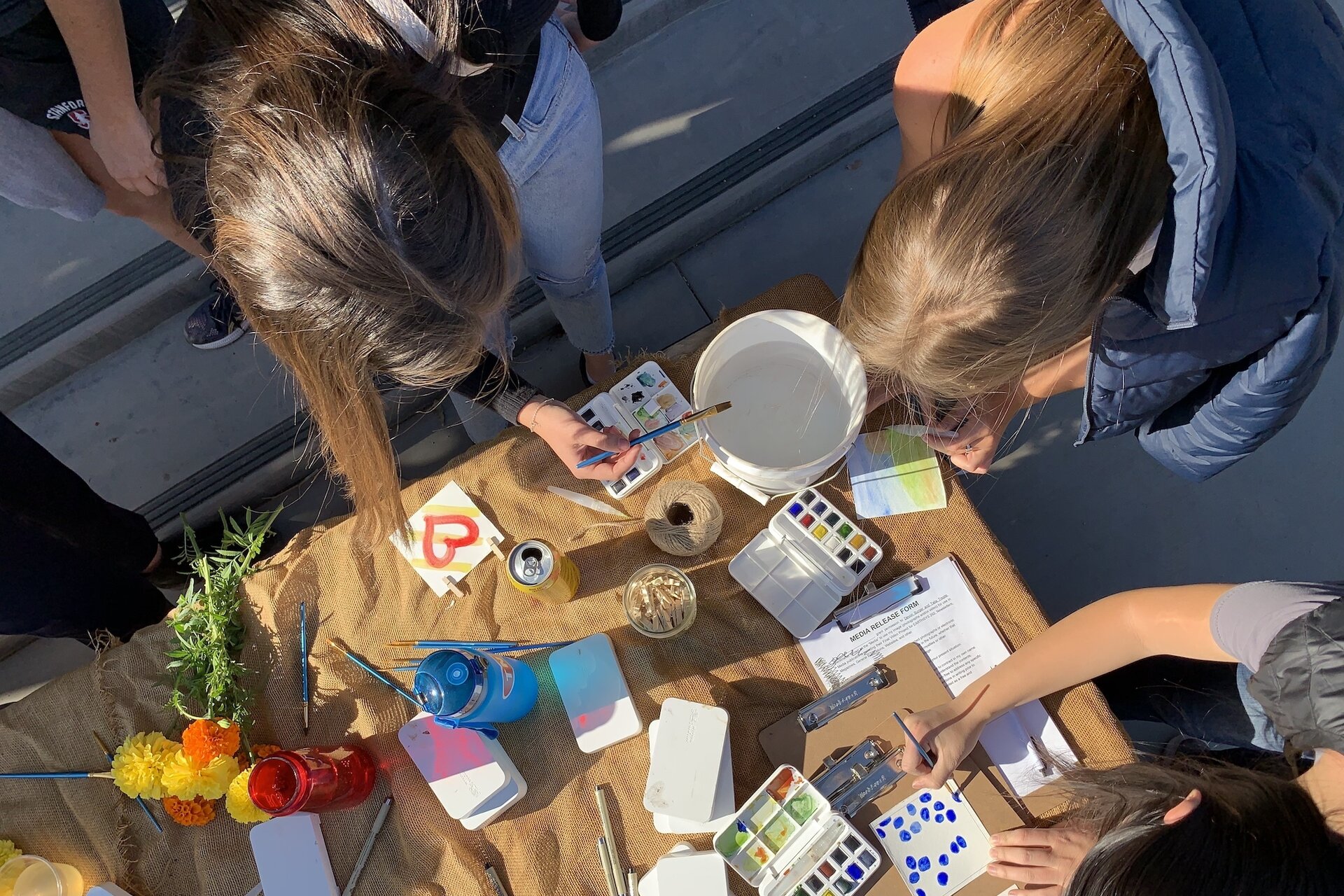 Overhead shot of people doing a crafts project